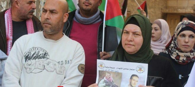 اعتصام أمام الصليب في جنين للمطالبة باسترداد جثماني الشهيدين جرار