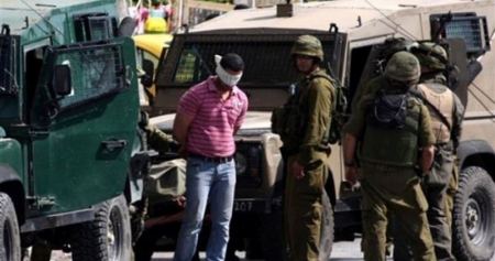 26 اعتقالا وإصابتين في الضفة الغربية